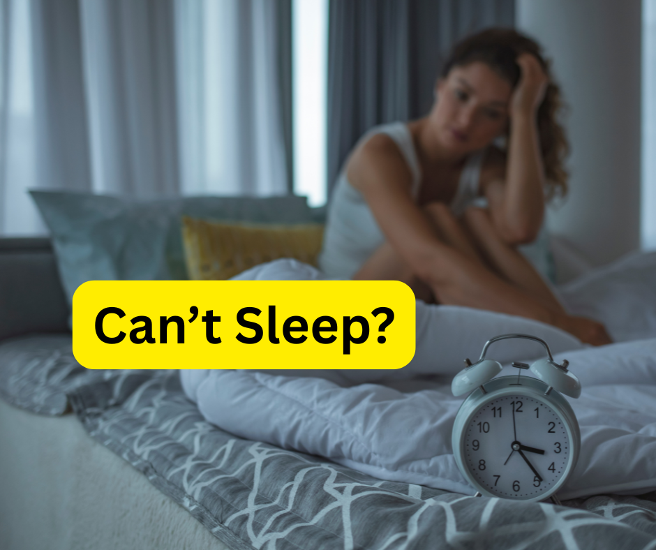 women awake in bed with clock face 3.25am