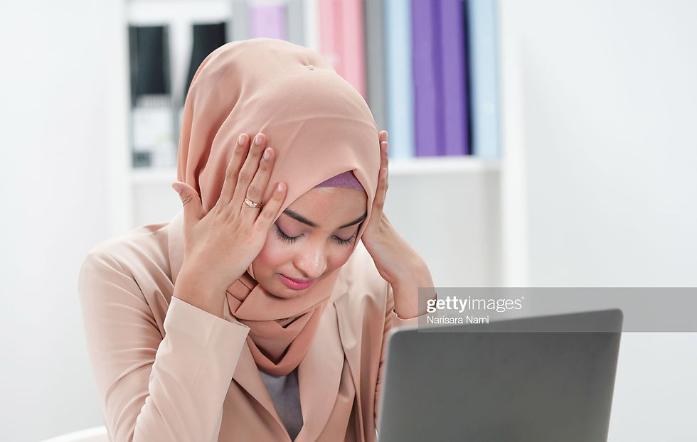 Muslim Asian woman stressed out, pressure, feeling unwell, upset and frustrated thinking about work or business in office with laptop