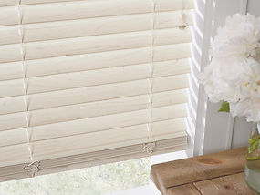 Everwood blinds and white flowers.
