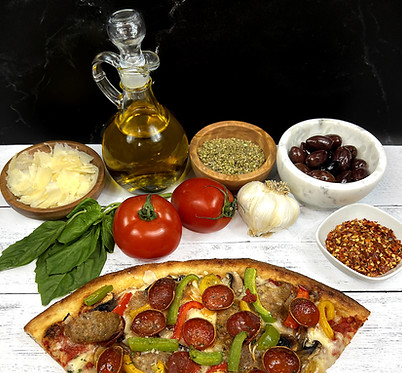 Supremo pizza slice surrounded by tomatoes, basil, garlic, spices, cheese, olive oil, and olives
