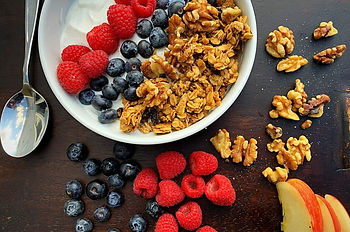 Bowl of oatmeal, fruit and nuts