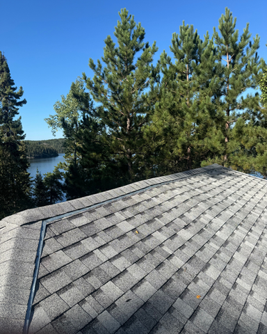 Completed asphalt shingle roof installation on a residential property by Flip Flop Construction in Manitoba