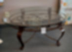 Glass-top, metal-base oval coffee table 48" x 37"
