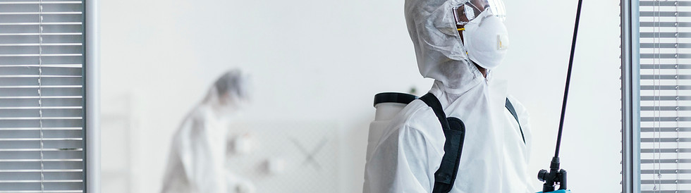 Professional janitorial disinfection team sanitizing high-risk area with protective equipment in California facility