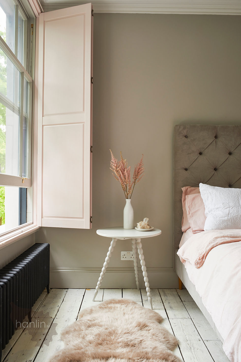 Oyster Sheepskin on Floor by Bed