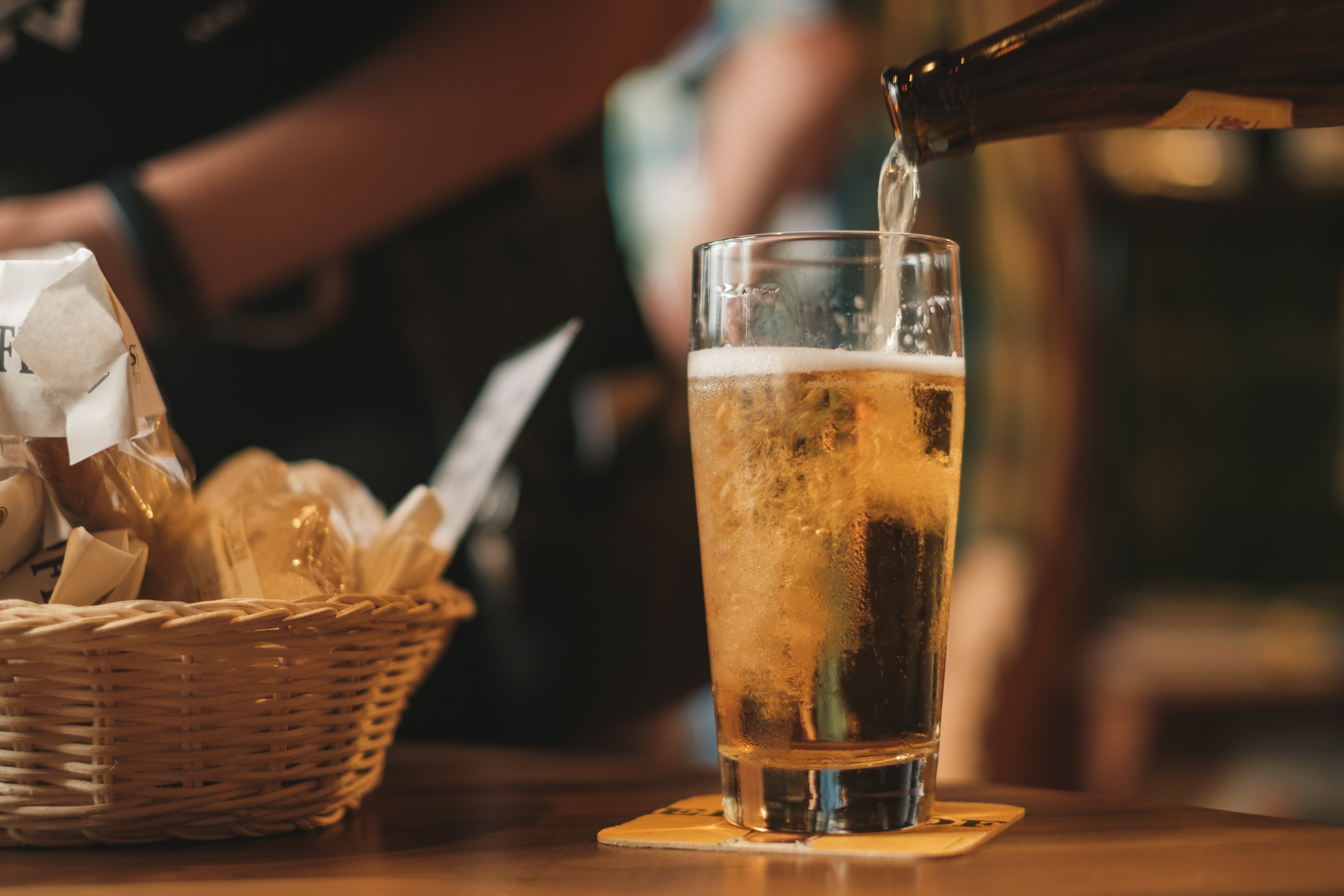 Glass of beer being poured, illustrating the role of soya protein concentrate