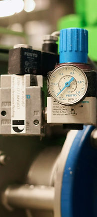 a machine with a gauge on the side of it