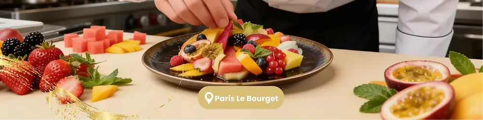 Chef adding gold leafs on a sliced fruit plate inside kitchen
