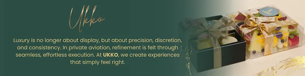 Green background with gold text: "Ukko." Emphasizes luxury, precision, discretion and consistency in aviation. Two gift boxes with fruit and ribbons on the right.