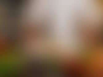 Chef in kitchen plating Tourbot fillet