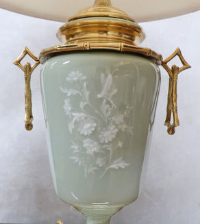 an antique French Victorian chinoiserie style pate sur pate table lamp with bamboo bronze gilt mounts and celadon porcelain body with flowers and dragonfly