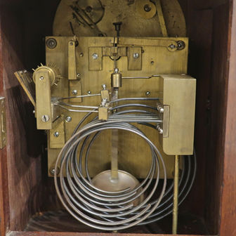 a German 19th century antique Westminster striking walnut bracket clock by Winterhalder and Hofmeier with silvered dial, strike silent mechanism which strikes the hours, quarters and half hours on five gongs.