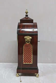 an antique English Regency wall bracket clock with mahogany case and brass inlay by Thomas Glaze with pull repeat action and eight day duration movement striking the hours on a bell