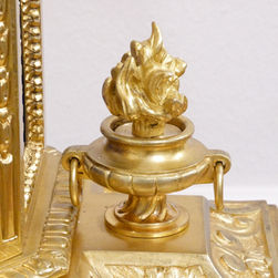A French gilt bronze 19th century antique mantel clock with cherubs to the top and royal blue porcelain panels. The movements strikes on a bell.