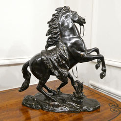 a pair of late 19th century antique bronze marly horses with male groom holding the reins signed Coustou