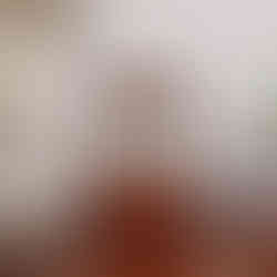 an antique French mahogany mantel clock with marquetry swag inlay to the front of the case in the Art Nouveau style