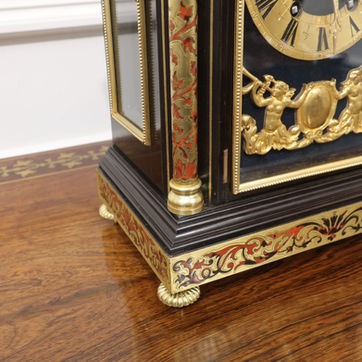 A French boulle antique mantel clock in the Louis XIV style with eight day movement striking on a gong