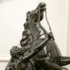 a pair of late 19th century antique bronze marly horses with male groom holding the reins signed Coustou