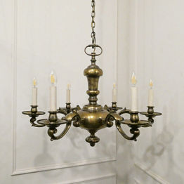 A large Edwardian antique brass chandelier with six arms attributed to Faraday & Son