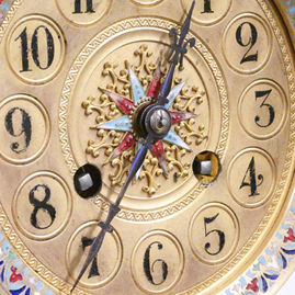 French onyx and champleve antique mantel clock with four glass panels and movement by Samuel Marti striking on a gong