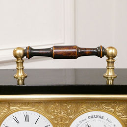Edwardian timepiece clock with aneroid barometer within an ebonised case