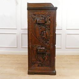 early 20th century Oriental camphor wood campaign chest of drawers profusely carved with seven drawers