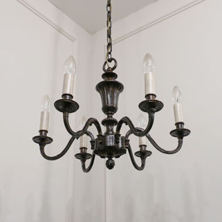 early 20th century medium French bronzed antique six arm chandelier with leaf design and central vase shaped body