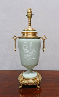 an antique French Victorian chinoiserie style pate sur pate table lamp with bamboo bronze gilt mounts and celadon porcelain body with flowers and dragonfly