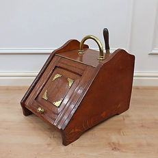 an antique Victorian oak coal scuttle