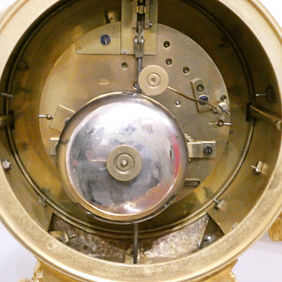 A French Louis XV style antique mantel clock with gilt bronze case and porcelain panels, by Jean Baptiste Delettrez