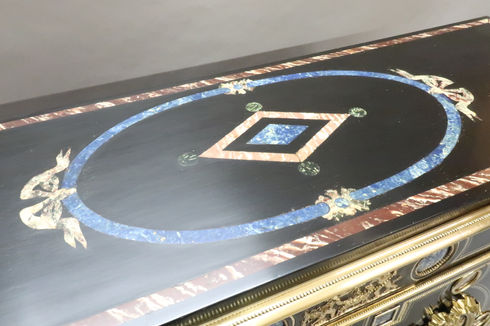 a decorative antique French Louis Philippe ebonised double doored side cabinet attributed to Georges  Monbro with bronze gilt ormolu mounts and lapis lazuli inlay