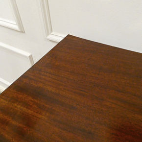 Regency mahogany bow fronted antique chest of drawers with brass handles standing on vase turned feet