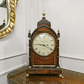 William IV gothic revival antique bracket clock with rosewood case and cluster columns. The twin fusee movement is by Barber & North of York which strikes the hours on a bell