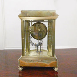 A French four glass, onyx and champleve antique mantel clock by Samuel Marti striking on a gong