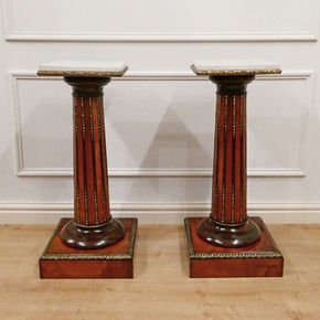 a pair of Victorian satinwood antique pedestals with square white carrara marble tops and fluted turned columns and gilt bronze mounts