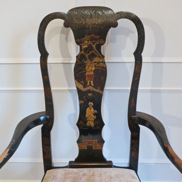 an antique Victorian black lacquered armchair in the Queen Anne style with chinoiserie oriental hand painted designs and raised gesso detail with trees and flowers standing on shaped cabriole legs and drop in upholstered seat
