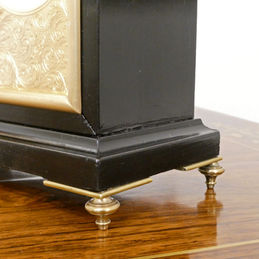 Edwardian timepiece clock with aneroid barometer within an ebonised case