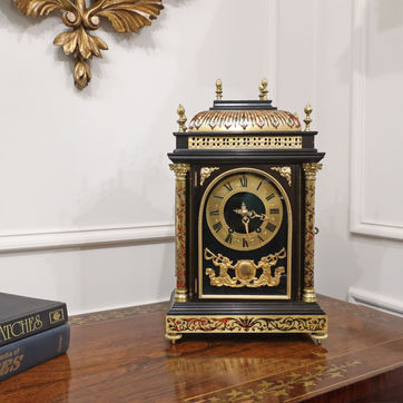 A French boulle antique mantel clock in the Louis XIV style with eight day movement striking on a gong