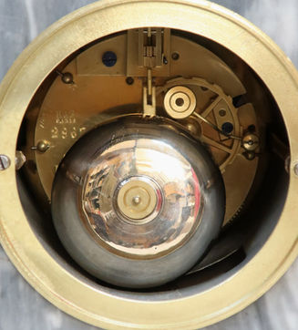 antique French Neoclassical style grey marble mantel clock with bronze gilt lions head ring carrying handles to the sides stood on scrolling lions paw feet