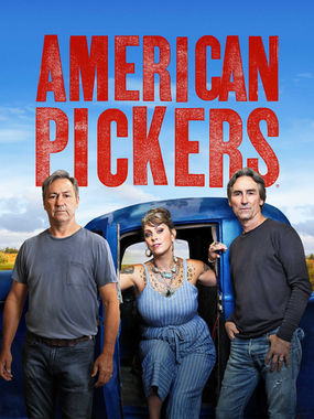 Rob Wolfe, Danielle colby, and Mike Wolfe stand in front of a blue pickup truck. 