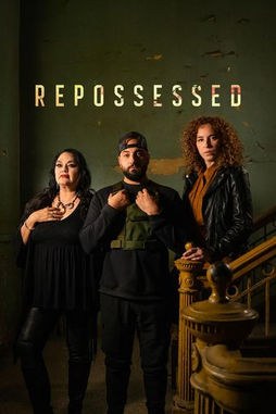 Three ghost hunters stand in a haunted house, on the stairwell. Repossessed. 
