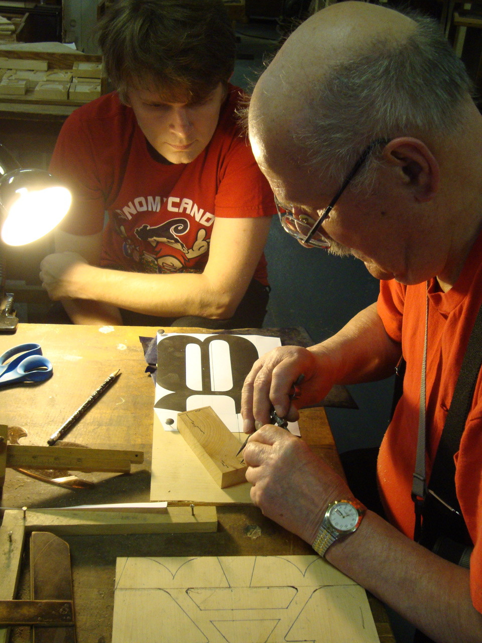 Designer Nick Sherman (left) conferring with Hamilton retiree Norbert Brylski at the original Hamilton factory in 2011.