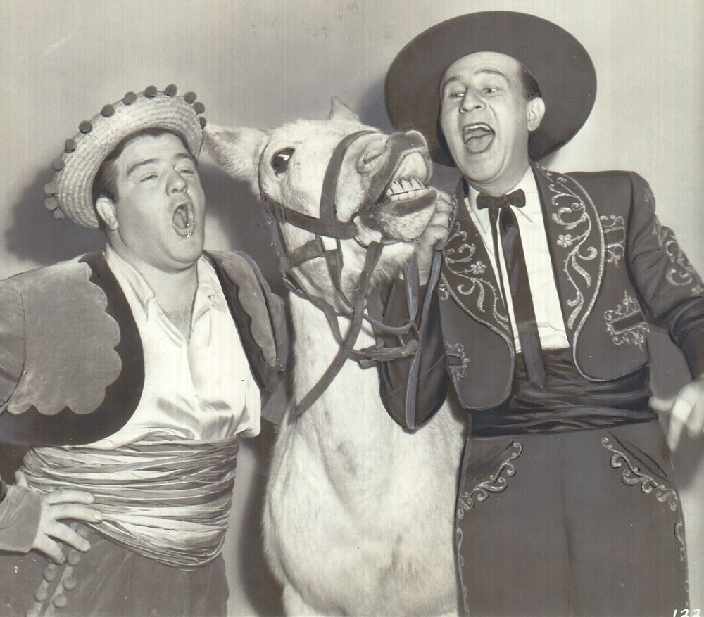 Abbott and Costello with singing donkey in “Rio Rita.”