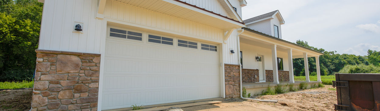 Modern white home with stone accents.