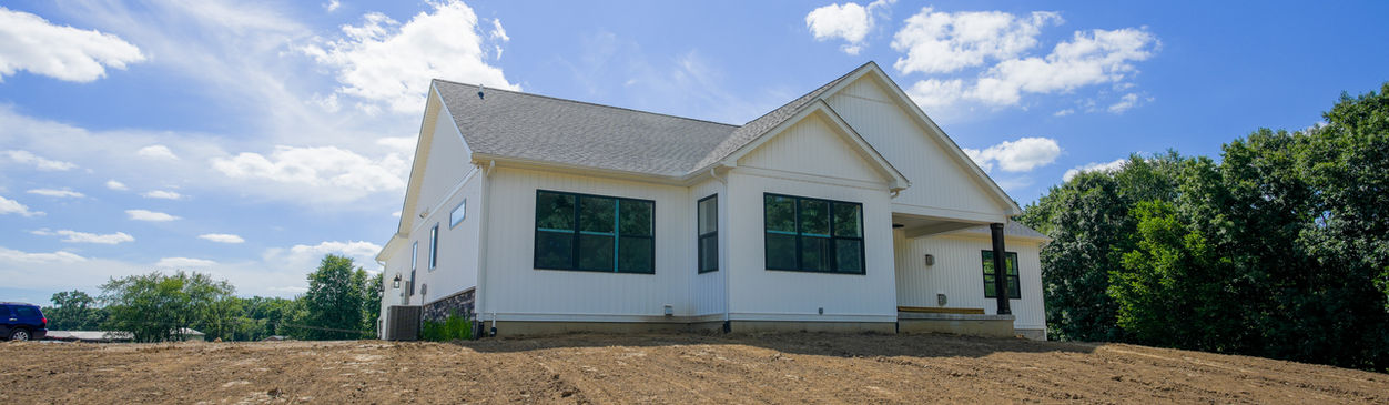 White house with a blue sky.