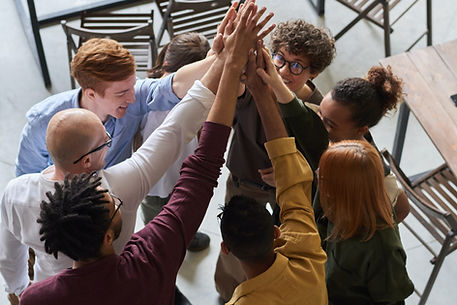 A group of people giving each other high fives.