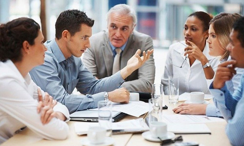 Office Workers AT Table with Water in Gl