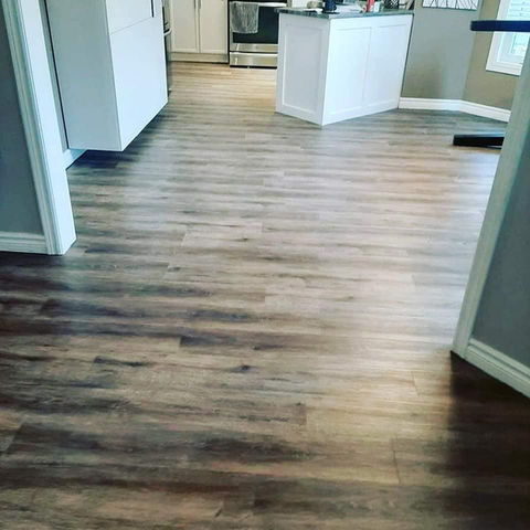 Installed dark brown hardwood flooring in the kitchen Home DurhamFlooring.ca flooring material types