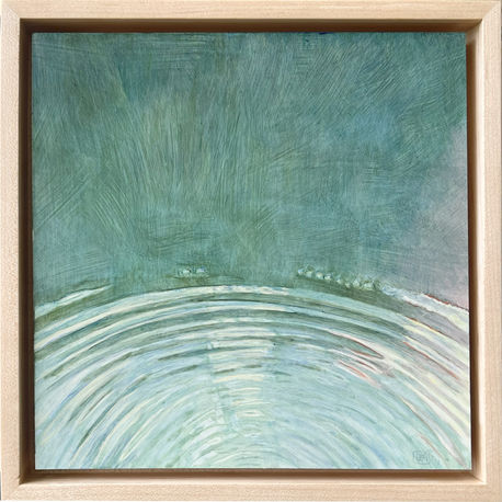 Radiating concentric ripples
in turquoise blue water
