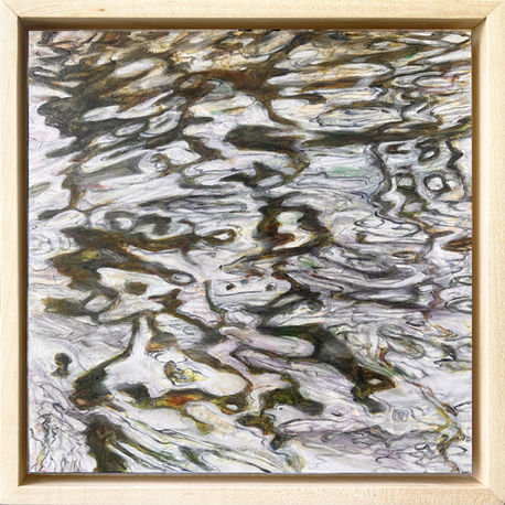 Scrambled reflected image over surface water ripples